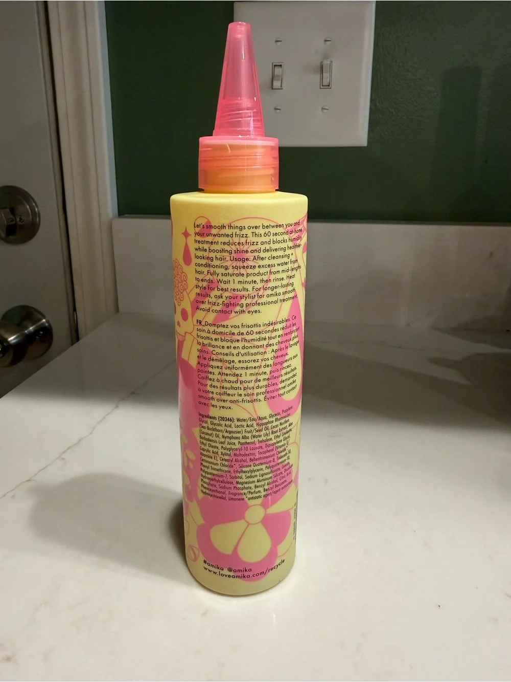 amika Smooth Over Frizz-Fighting Treatment — Yellow & Pink Bottle